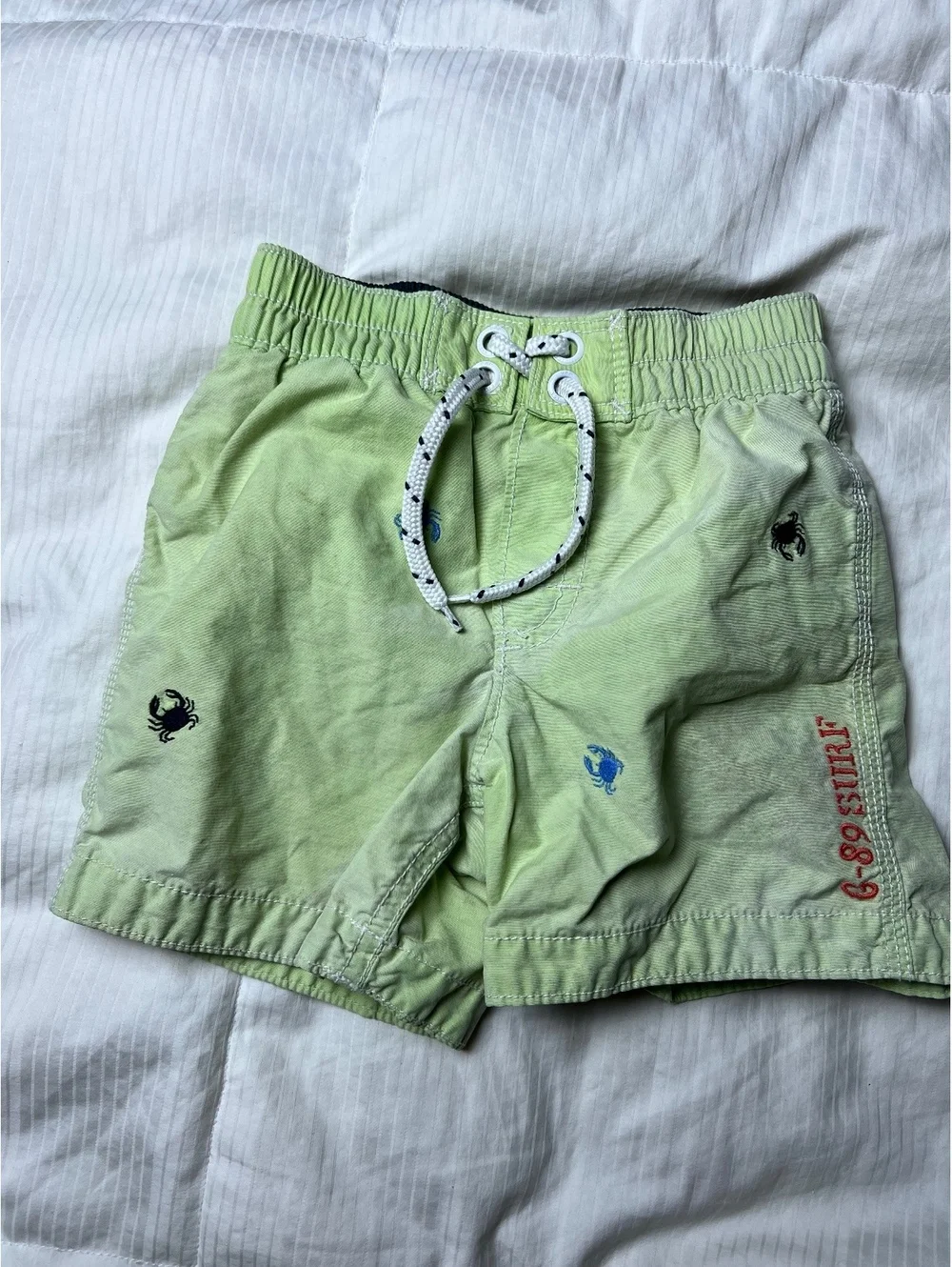 Baby Gap light green embroidered swim trunks size 18-24m